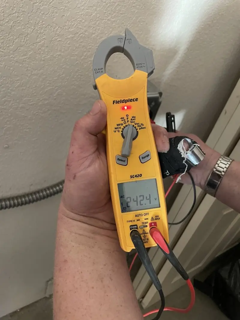 Voltage testing with clamp meter during Generator Installation in Minnetonka